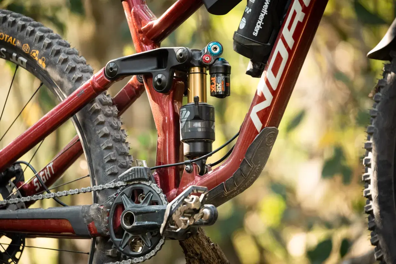 Close-up of a Norco Sight bike's rear suspension, featuring a Fox Float X2 shock. This detailed shot is perfect for a fox float x2 review.
