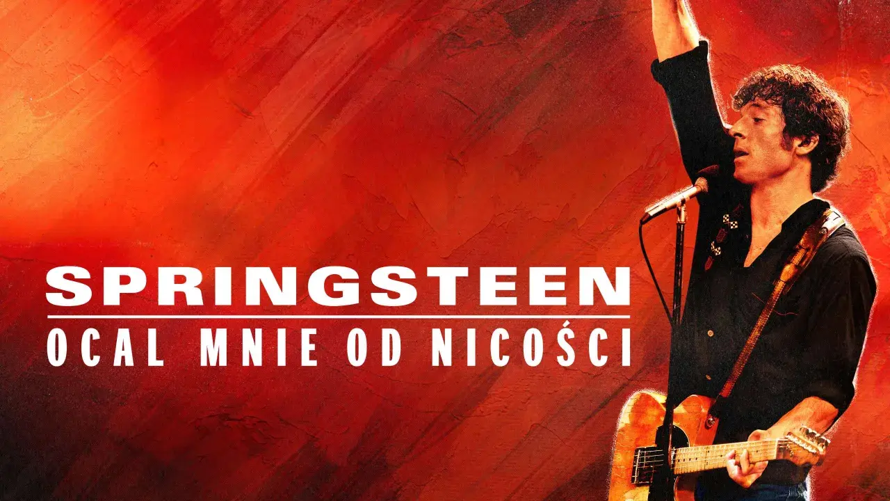 Bruce Springsteen na tle czerwonej ściany, z gitarą i mikrofonem. Napis "Springsteen Ocal mnie od nicości" sugeruje jego koncert w Polsce.