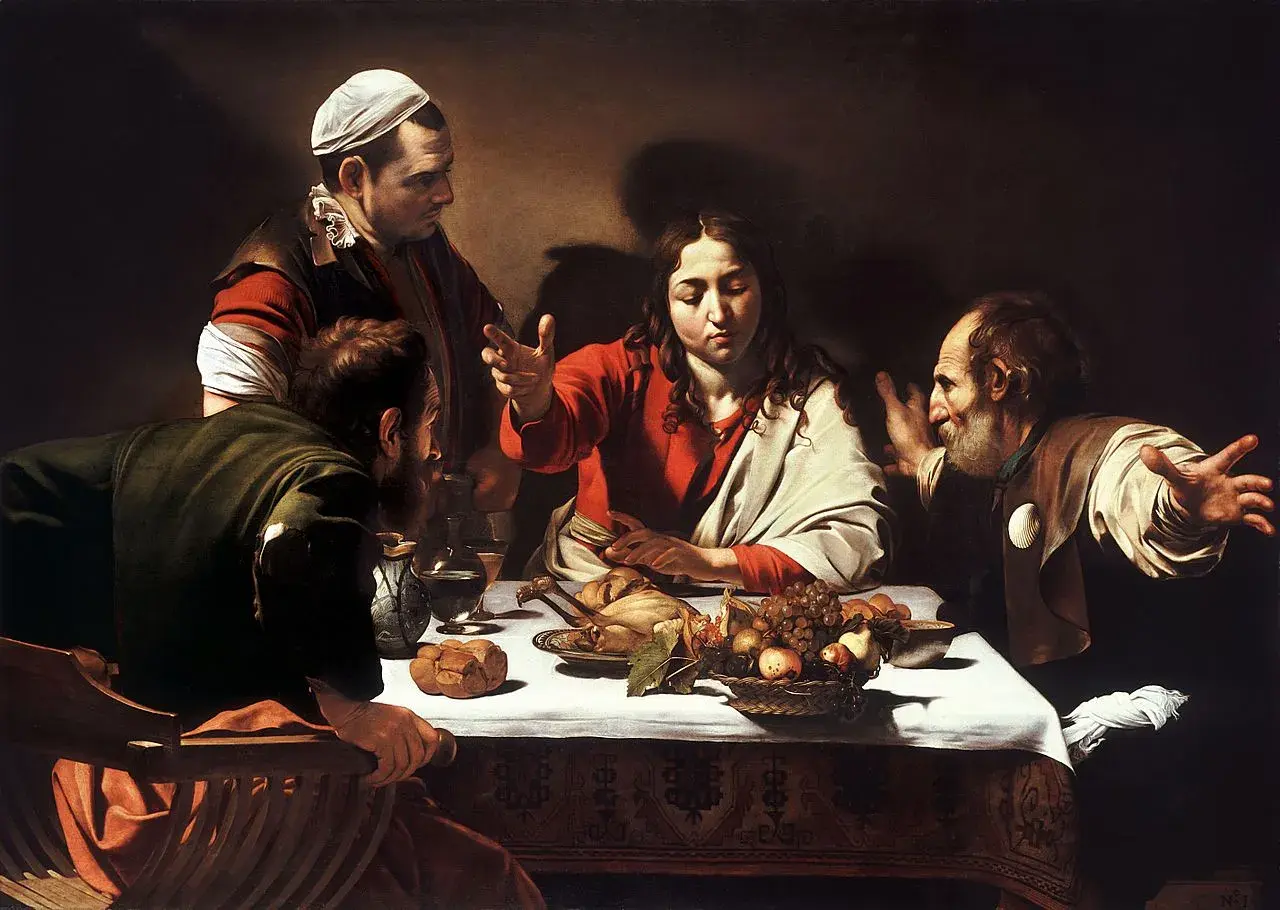 Caravaggio's Supper at Emmaus: Jesus blesses a meal with disciples, one gesturing in surprise.