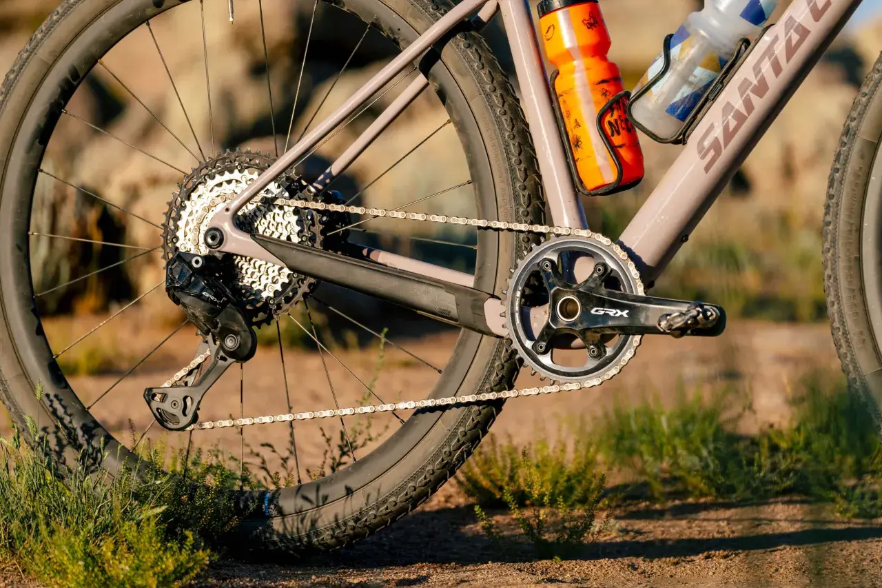 Close-up of a gravel bike's drivetrain, featuring Shimano GRX components. A detailed shimano grx review would highlight this robust gearing.