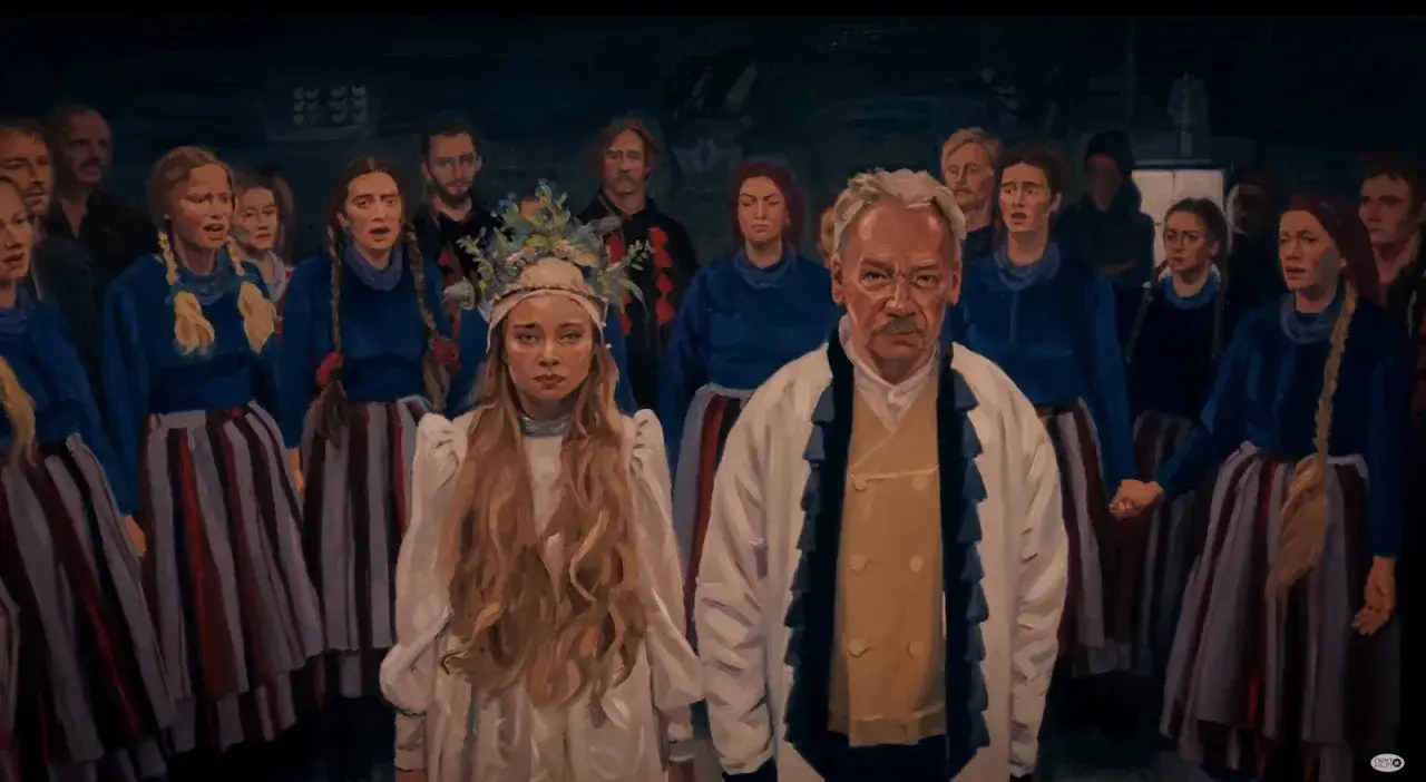 Grupa ludzi w tradycyjnych strojach, z młodą kobietą w białej sukni i wianku na czele. W tle widać innych mężczyzn i kobiety, przypominających **chłopów** z dawnych czasów.