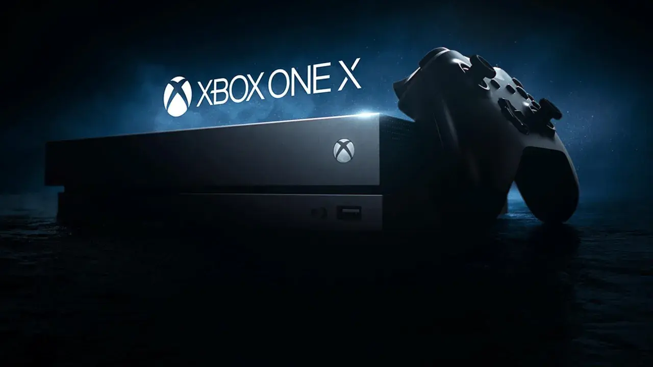 Konsola Xbox One X i kontroler na ciemnym tle. Gotowi na epicką rozgrywkę?