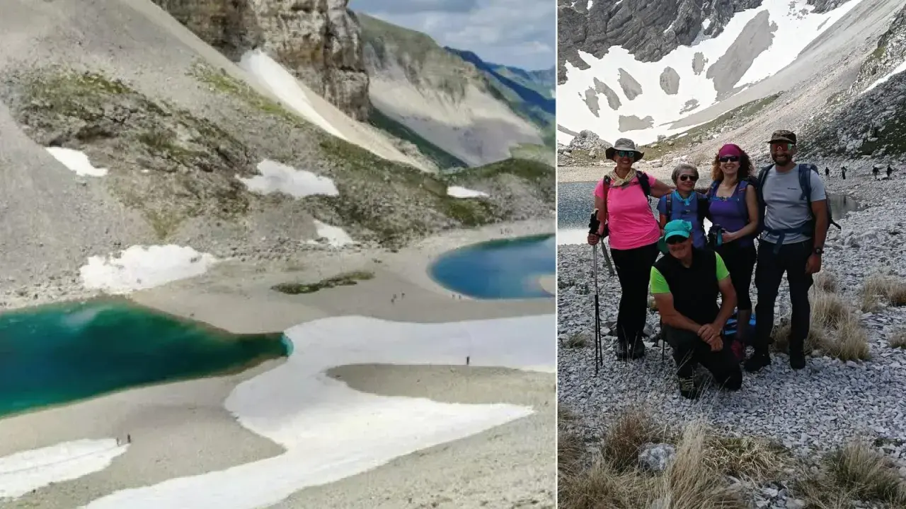 Gruppo di escursionisti al lago di Pilato, con le sue acque turchesi e i nevai circostanti.
