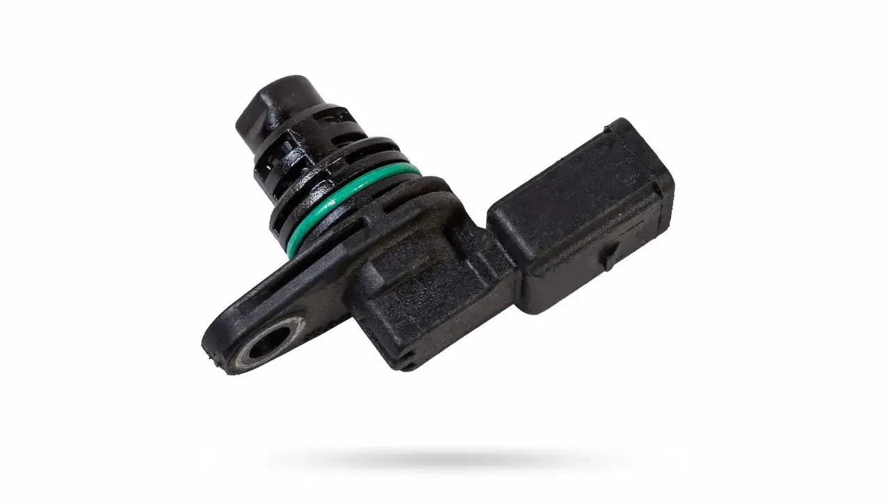 Capteur vilebrequin noir avec bague verte, essentiel pour le bon fonctionnement du moteur.