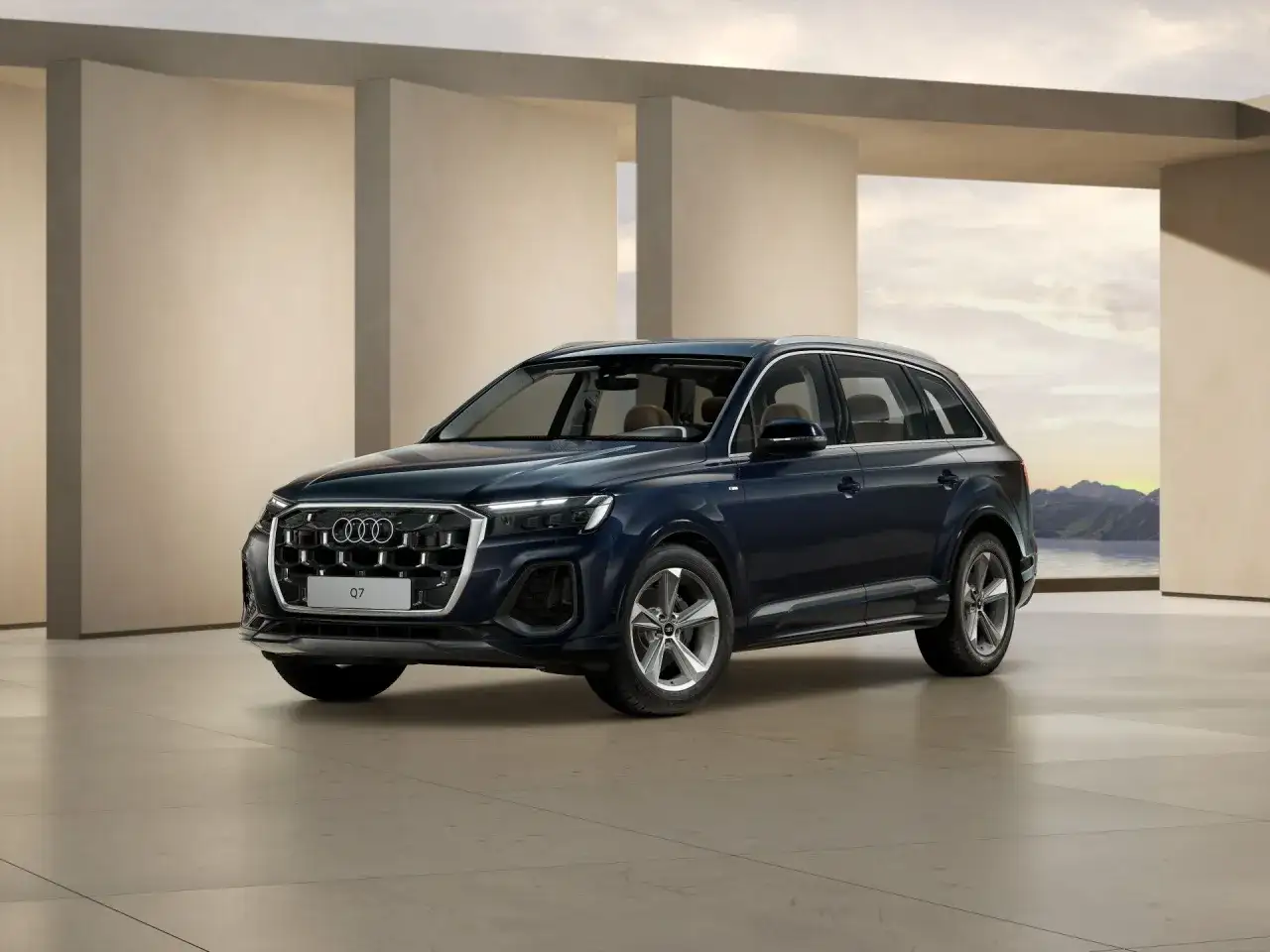 Eleganckie, ciemnogranatowe nowe Audi Q7 prezentuje się na tle nowoczesnej architektury i malowniczego krajobrazu.