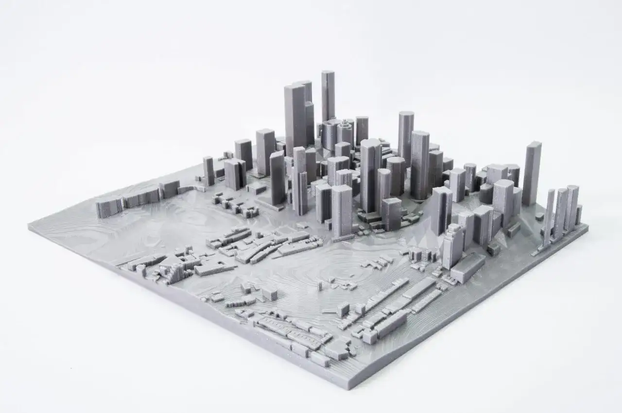 Model miasta z wieżowcami i niską zabudową, stworzony przez mapping 3d.