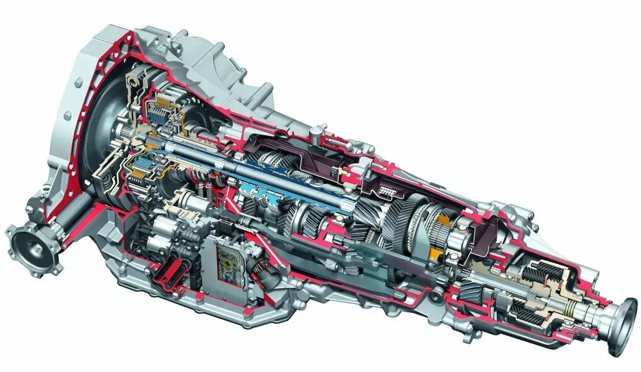 Przekrój skrzyni biegów do Audi z silnikiem 3.0 TDI. Widoczne koła zębate, wałki i elementy hydrauliczne.