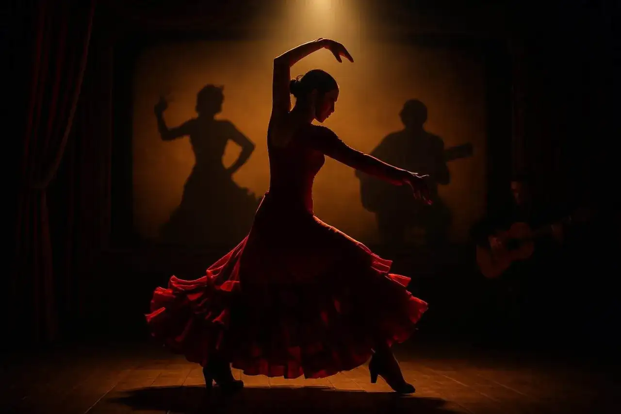 Bailarina de flamenco con vestido rojo, sombras de guitarrista y bailaora en el fondo. Escena de un documental flamenco.