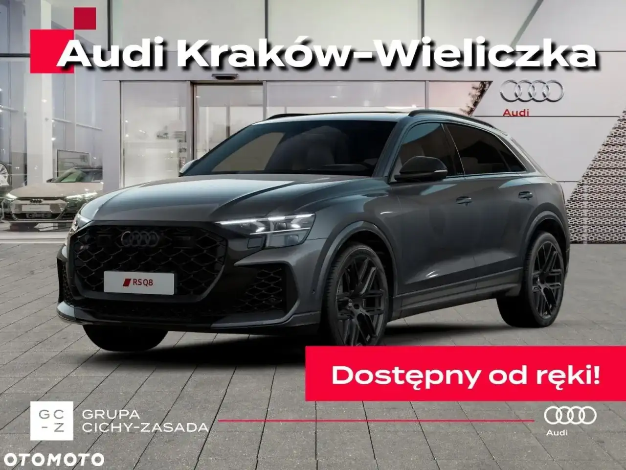 Szary Audi RS Q8 przed salonem Audi Kraków-Wieliczka. Sprawdź aktualną audi rsq8 cena i dostępność od ręki!