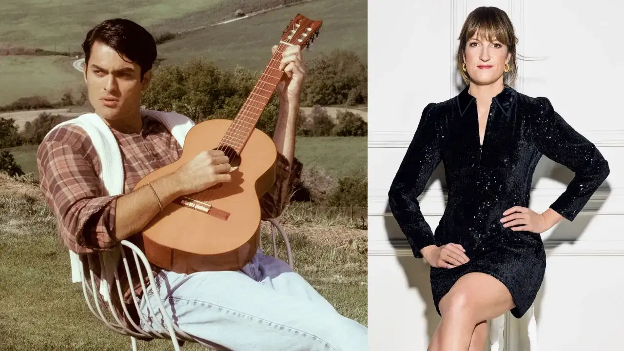 Mężczyzna gra na gitarze w plenerze, kobieta w czarnej sukience siedzi.