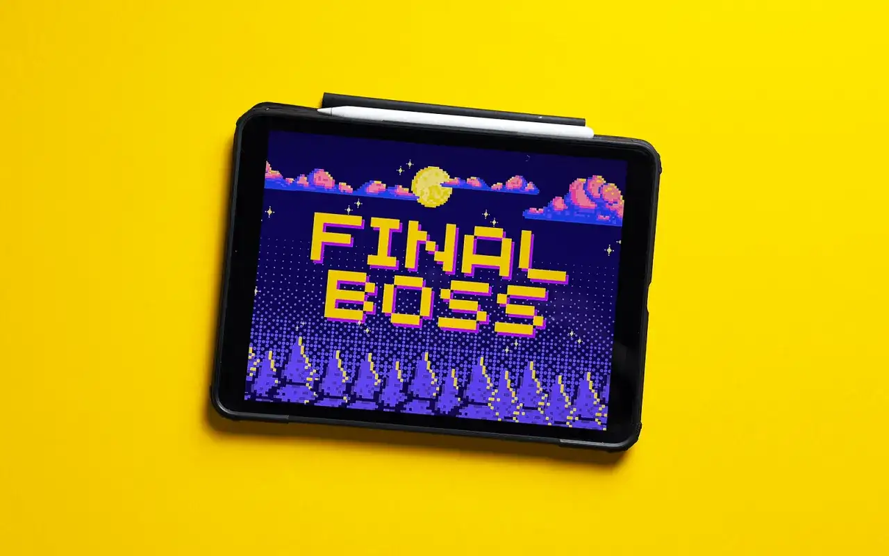 Tablet z grą retro, na ekranie napis "FINAL BOSS" w pikselowej grafice, nocny krajobraz z księżycem i chmurami.