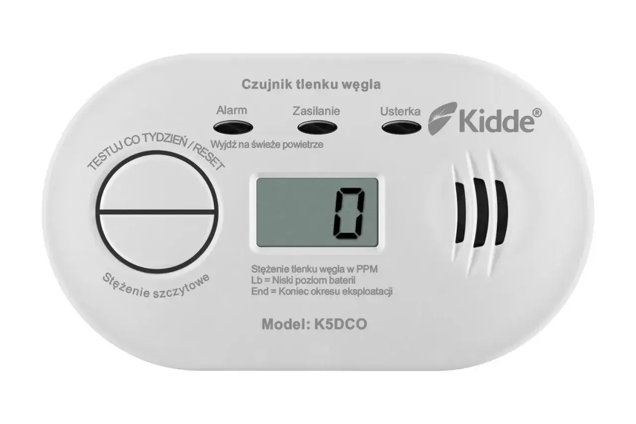 Biały czujnik tlenku węgla Kidde z wyświetlaczem pokazującym "0" i przyciskiem Test/Reset.