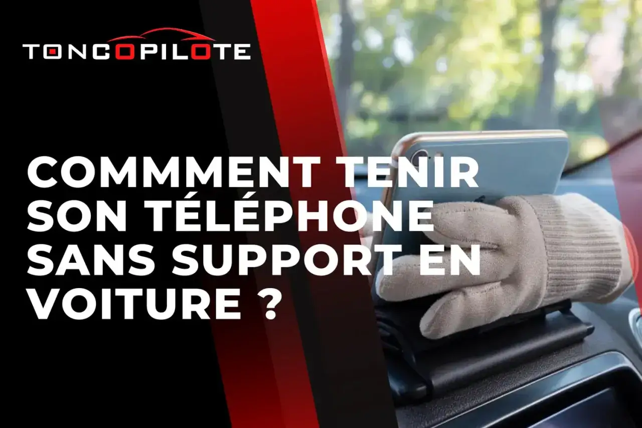 Astuce pour comment faire tenir son téléphone en voiture sans support : une main gantée maintient le téléphone sur le tableau de bord.