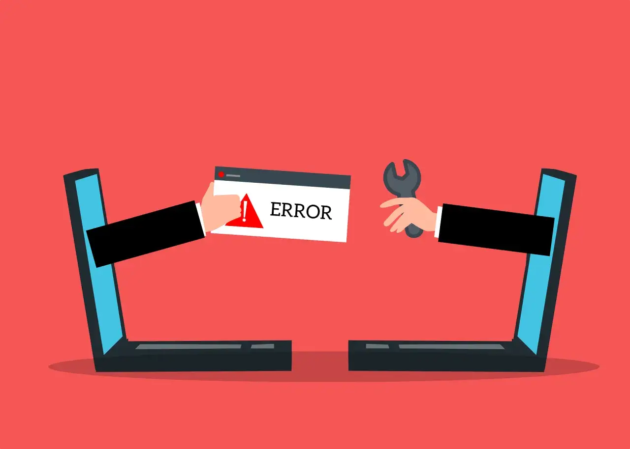Dwie ręce wychodzące z laptopów. Jedna trzyma komunikat "ERROR", druga klucz francuski. Strona w przebudowie.