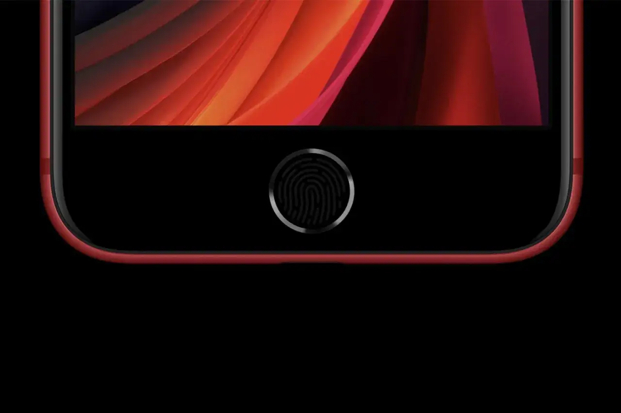 iPhone SE rouge avec son bouton d'accueil et son empreinte digitale pour le déverrouillage.