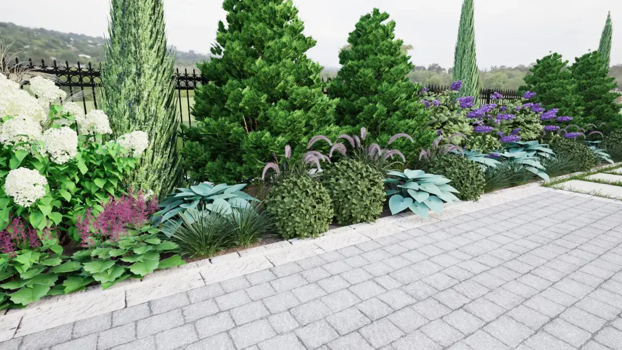 Piękny pas zieleni przed ogrodzeniem: białe hortensje, fioletowe kwiaty i ozdobne trawy tworzą malowniczy krajobraz.