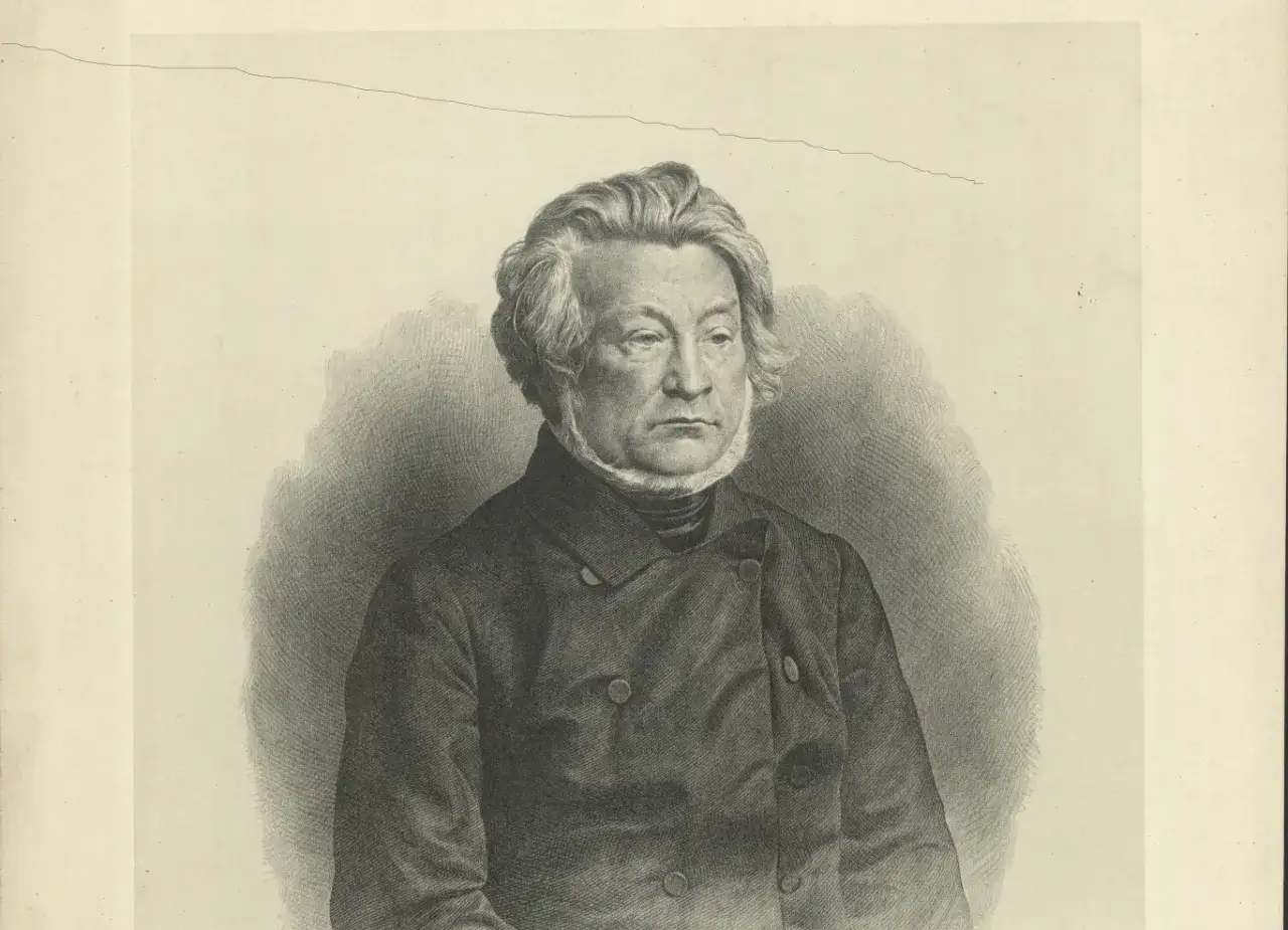 Portret mężczyzny w stroju z epoki, z bujnymi włosami i bokobrodami, w ciemnej marynarce.