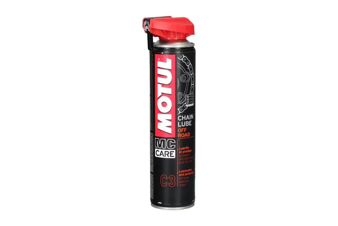 Puszka oleju Motul MC CARE C3 Chain Lube Off Road z czerwonym aplikatorem.