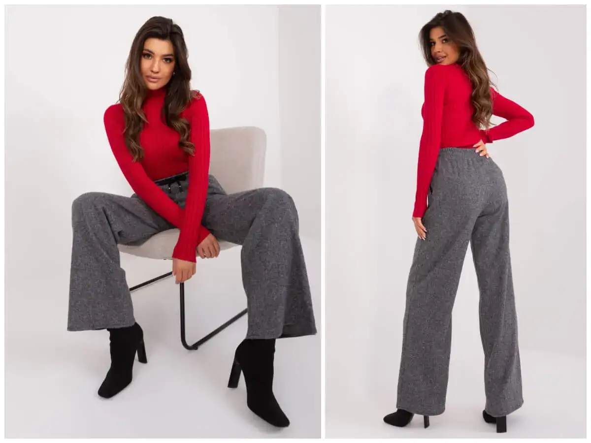 Eleganckie stylizacje z szerokimi, szarymi spodniami i czerwoną bluzką.