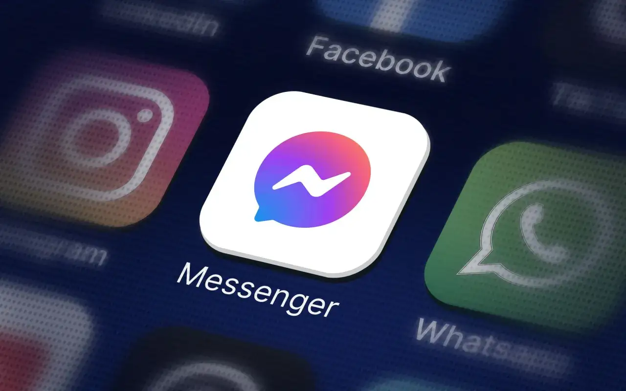 Ikona aplikacji Messenger na ciemnym tle, obok ikon Instagram, Facebook i WhatsApp.
