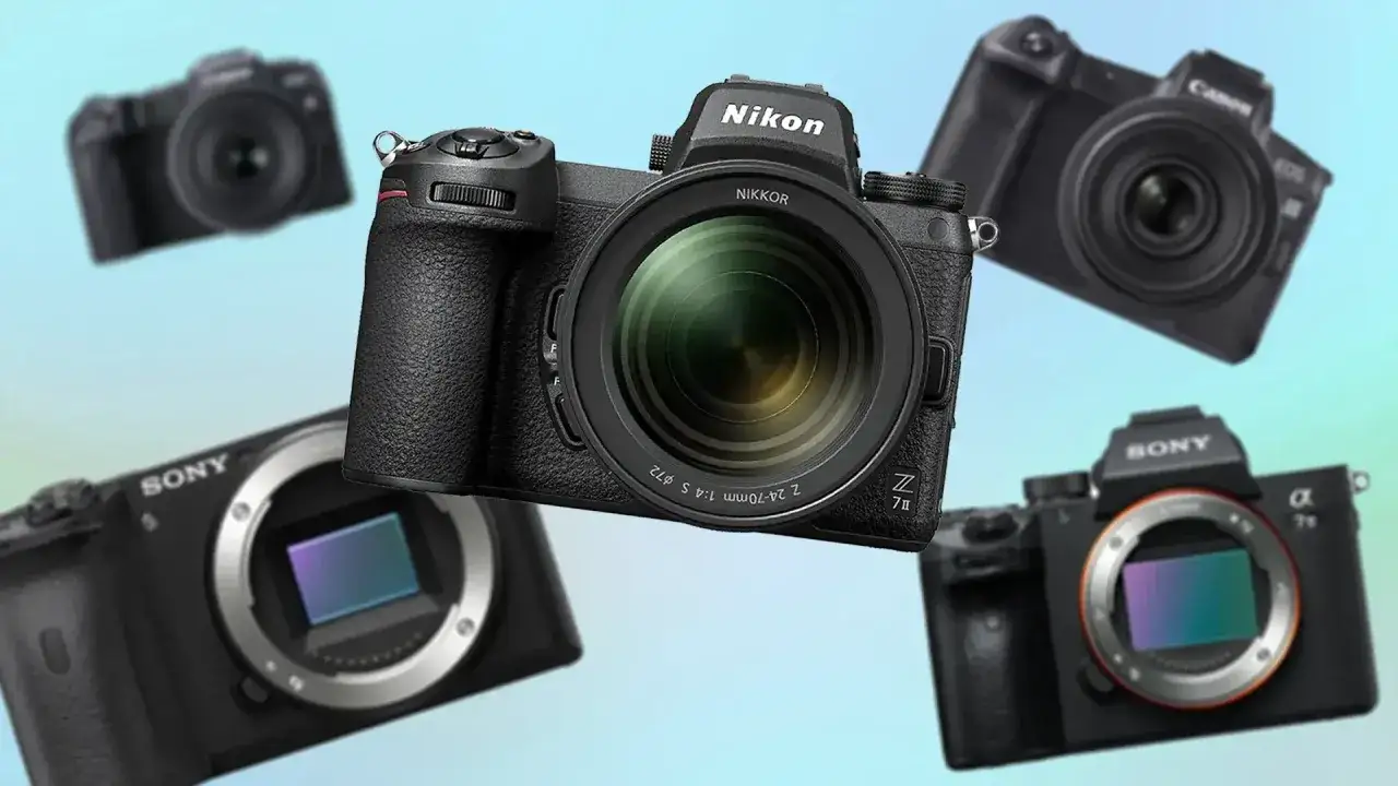 Kilka czarnych aparatów cyfrowych różnych marek (Nikon, Sony, Canon) na jasnoniebieskim tle.