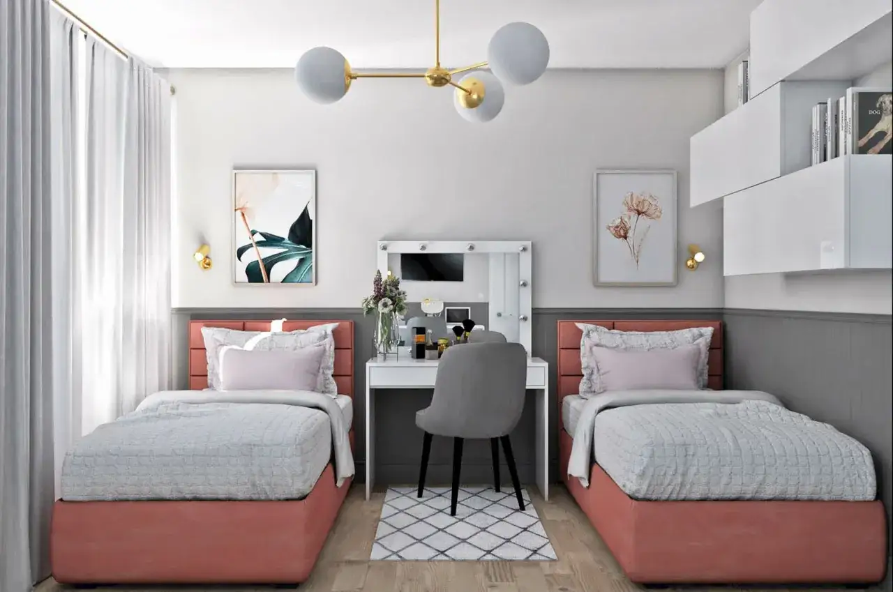 Przytulny pokój dla dwóch nastolatek z dwoma łóżkami, toaletką i półkami.