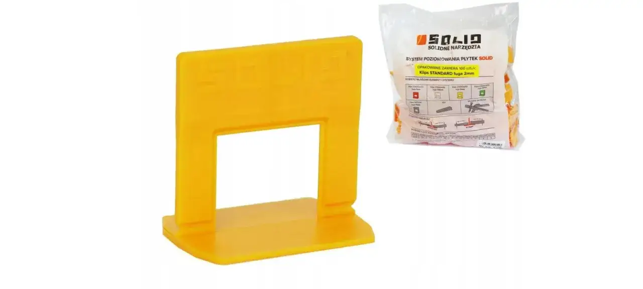 Żółty klips systemu poziomowania płytek SOLID. Opakowanie zawiera 100 sztuk klipsów o fugi 2mm.