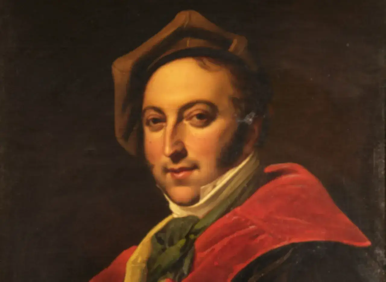 Portret Gioacchino Rossiniego w czerwonej todze i brązowym kapeluszu.