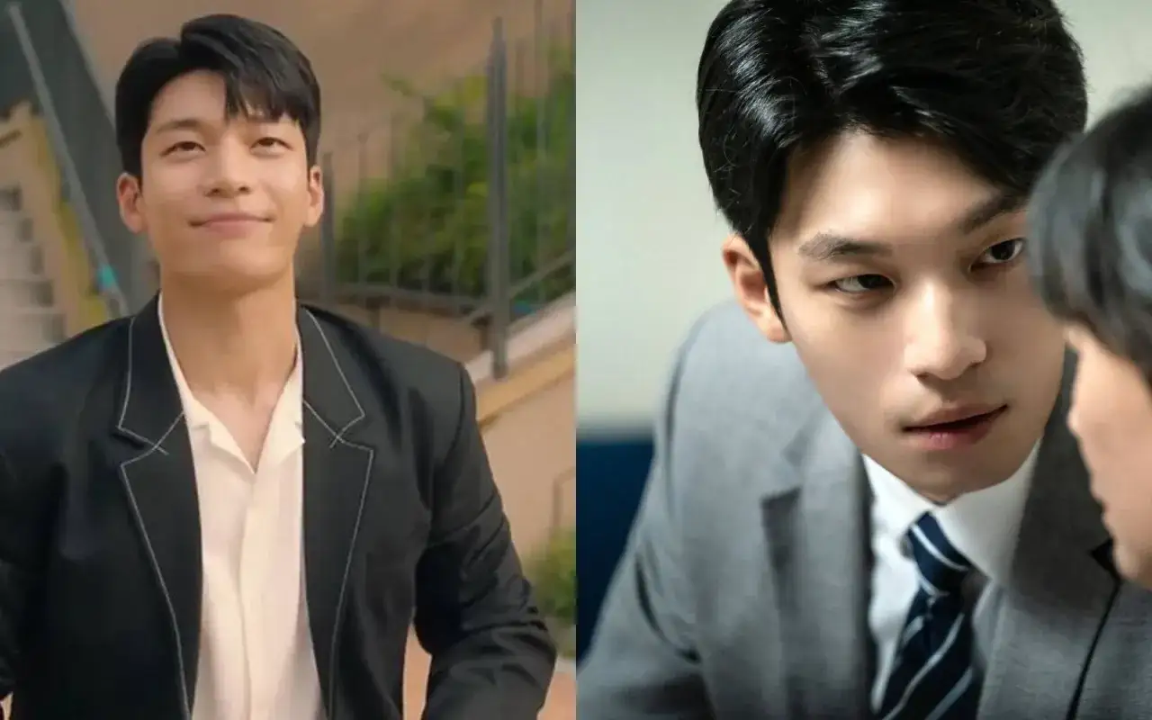 Wi Ha-joon w czarnym garniturze i białej koszuli uśmiecha się, a obok w szarym garniturze patrzy intensywnie.