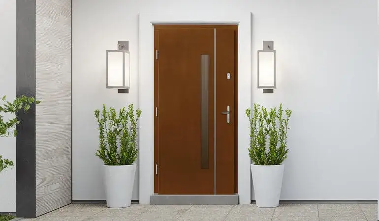 Drzwi metalowe czy drewniane do domu - co wybrać dla bezpieczeństwa i stylu?