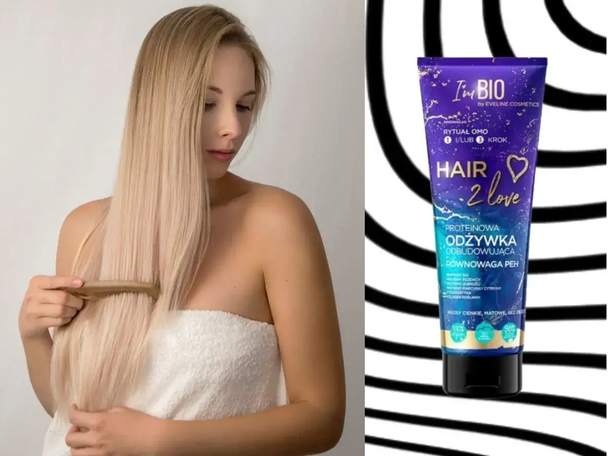 Blondynka czesze długie włosy. Obok tubka odżywki proteinowej odbudowującej, idealnej na włosy cienkie i matowe.