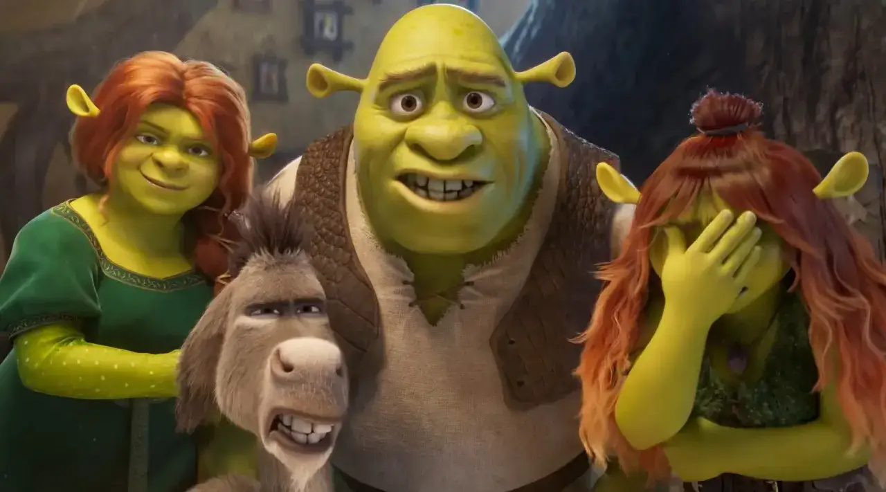 Shrek, Fiona i Osioł w oczekiwaniu na shrek 5 premiera. Jedna z córek zakrywa twarz, jakby nie mogła uwierzyć.