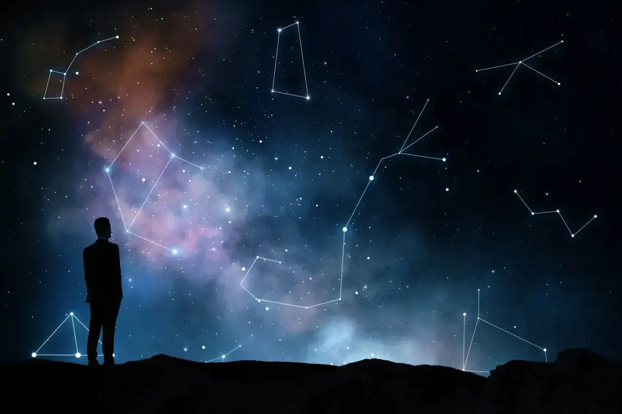 Człowiek wpatruje się w nocne niebo pełne gwiazd i konstelacji, szukając odpowiedzi, czy wśród nich kryje się najgorszy znak zodiaku.