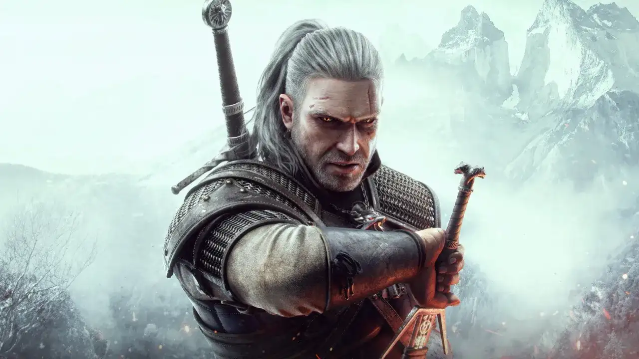 Geralt z Rivii, wiedźmin, z mieczem w dłoni, gotowy do walki. Jego spojrzenie mówi więcej niż wiele wiedźmin cytaty.