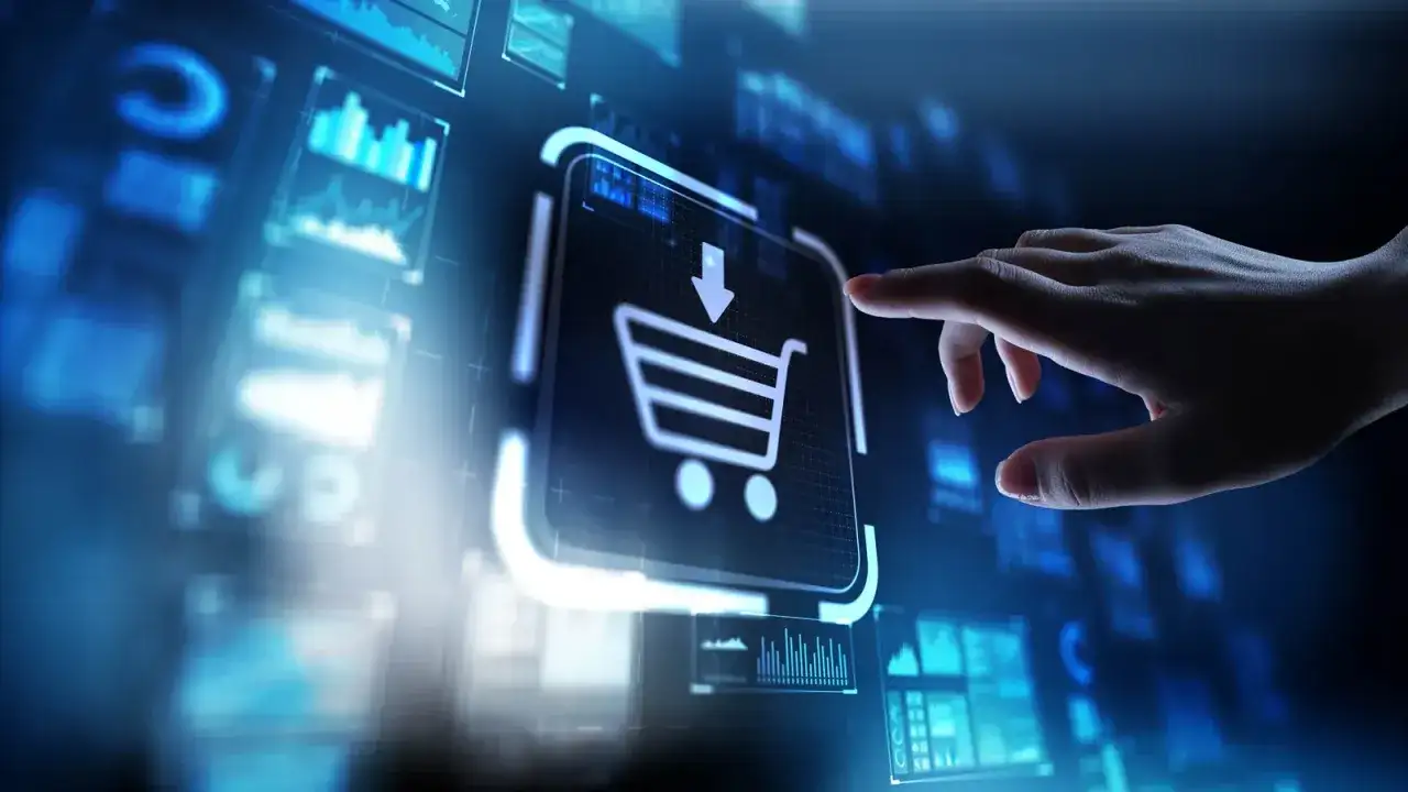 Dłoń dotyka ikony koszyka na ekranie, symbolizując zakupy online i rozwój e-commerce.