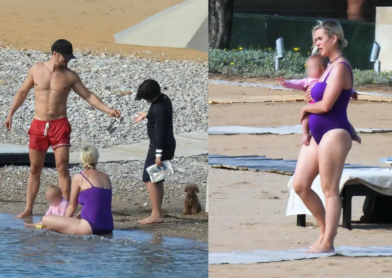 Katy Perry z dziećmi na plaży. Wokalistka w fioletowym stroju kąpielowym trzyma na rękach córkę.