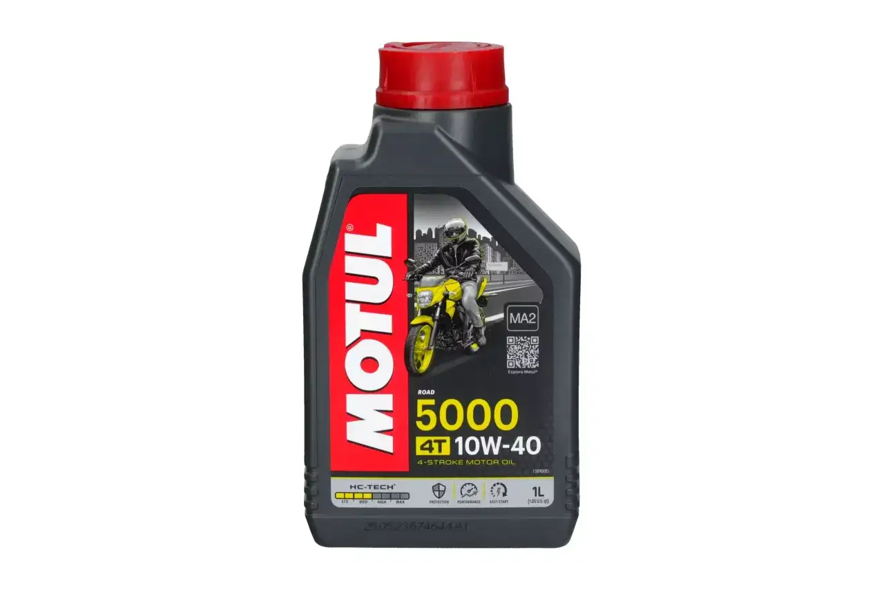 Butelka oleju Motul 5000 10W-40 z motocyklistą na etykiecie.
