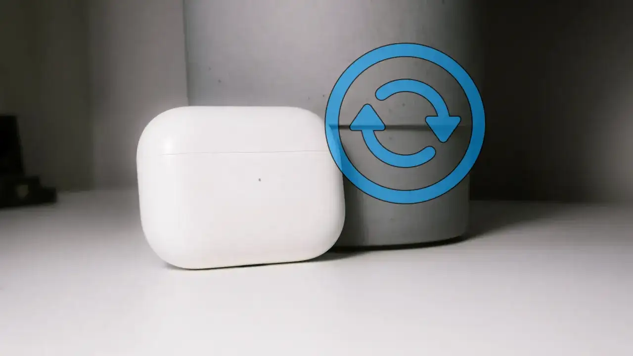 Białe etui AirPods z niebieską ikoną resetowania.