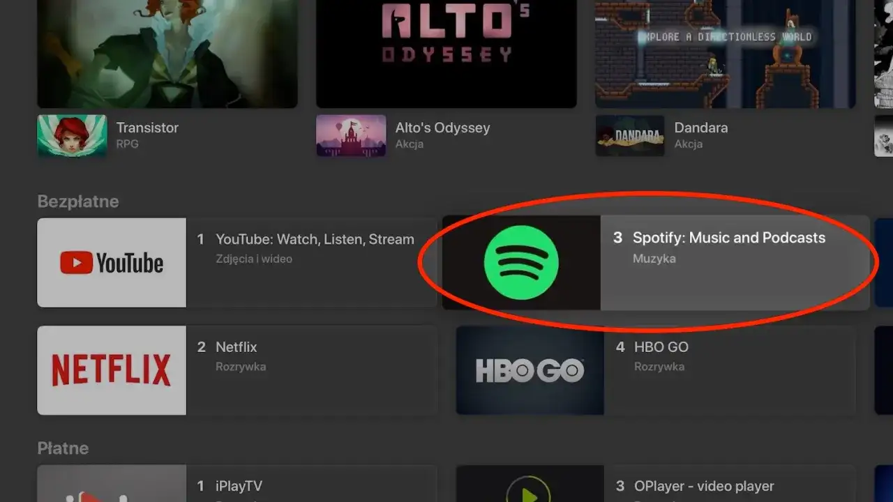 Ikona Spotify na liście aplikacji telewizyjnych, obok YouTube i Netflix.