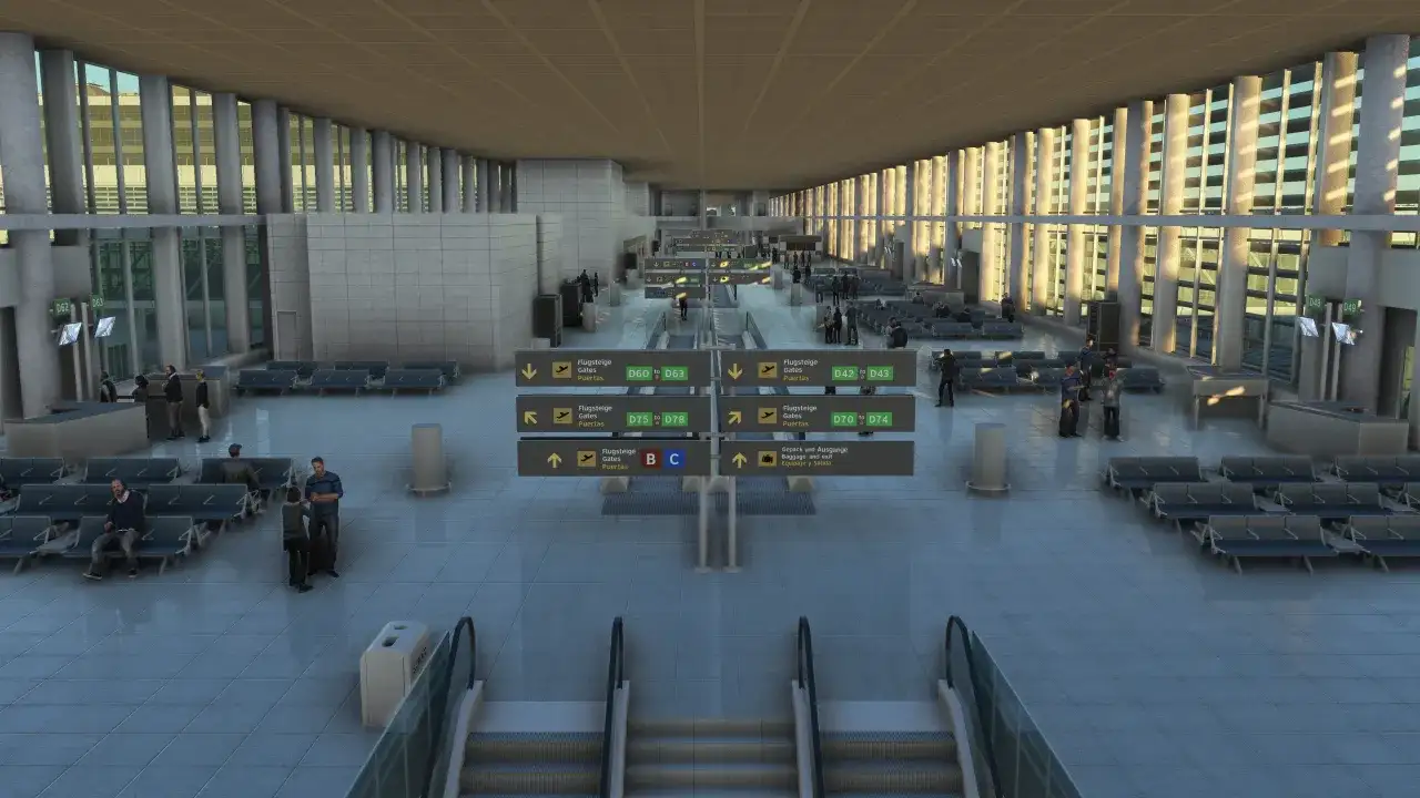 Nowoczesny terminal lotniska Malaga z rzędami siedzeń, tablicami informacyjnymi i pasażerami czekającymi na loty.