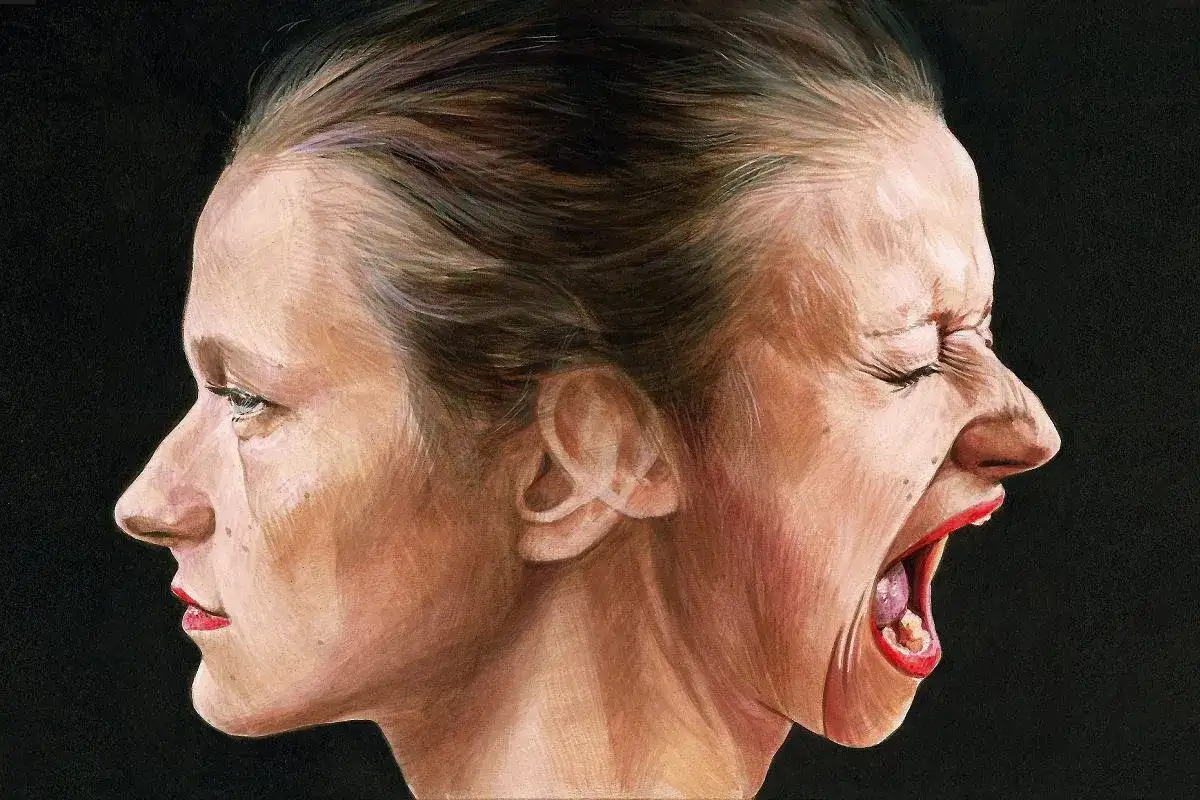 Dwie twarze połączone tyłem do siebie, jedna spokojna, druga krzycząca.