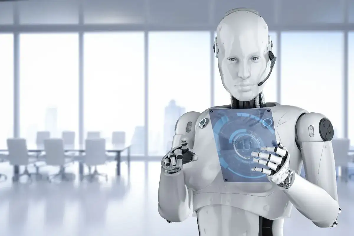 Robot z interfejsem dotykowym w nowoczesnym biurze. Czy sztuczna inteligencja to szansa czy zagrożenie dla przyszłości?