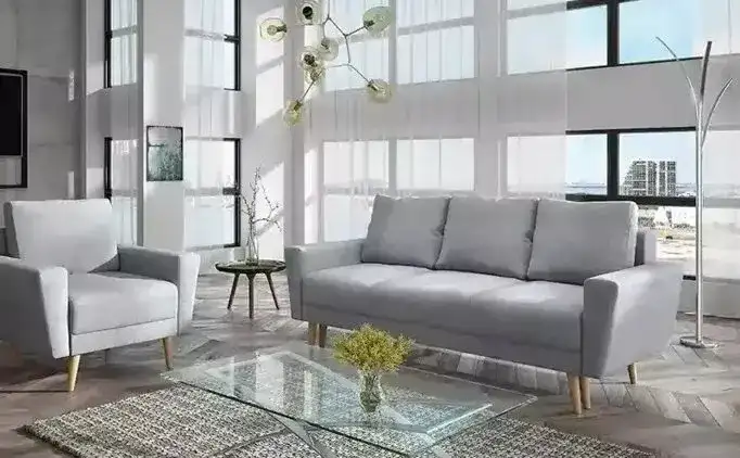 Jak zaaranżować salon z szarą kanapą? Inspiracje i porady