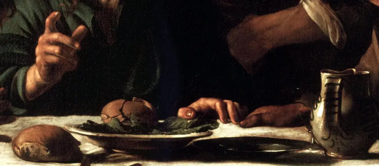 Wieczerza w Emaus Caravaggia: ręka wskazuje na chleb, obok dzban i talerz z sałatą.