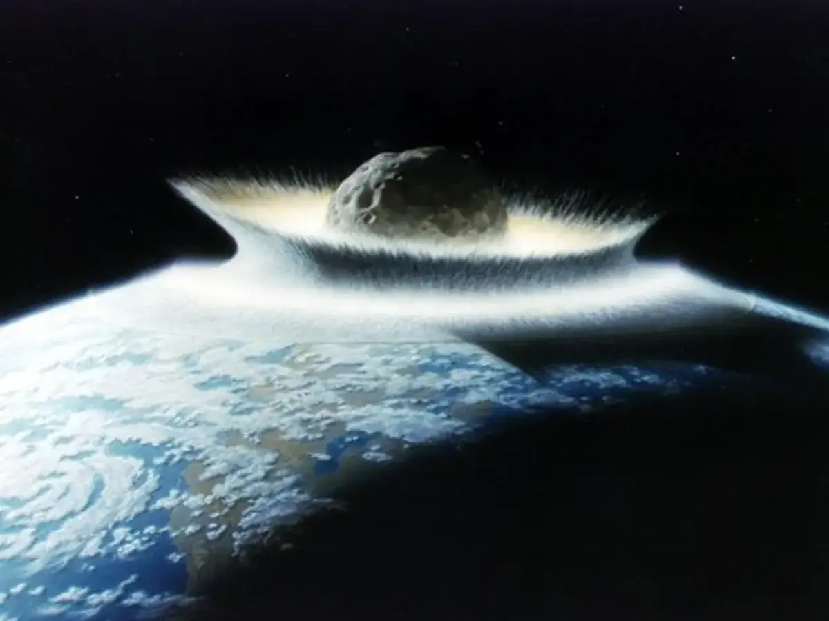 Meteor o znacznych rozmiarach uderza w Ziemię, tworząc oślepiający rozbłysk i chmurę pyłu.