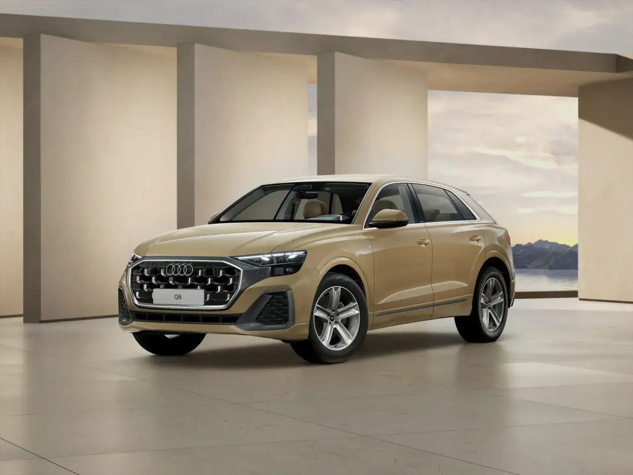 Elegancki, beżowy Audi Q8 prezentuje się w nowoczesnym wnętrzu z widokiem na góry. Sprawdź aktualną audi q8 cena.