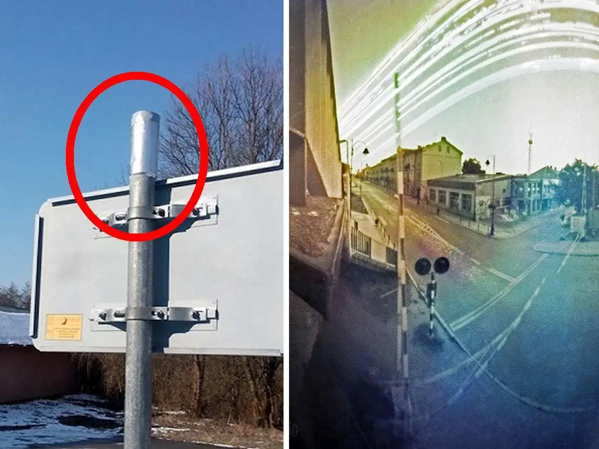 Solarigrafia uchwyciła ruch uliczny i niebo nad miastem. Na pierwszym planie widać słup z tablicą, a na drugim ulicę z przejazdem kolejowym.