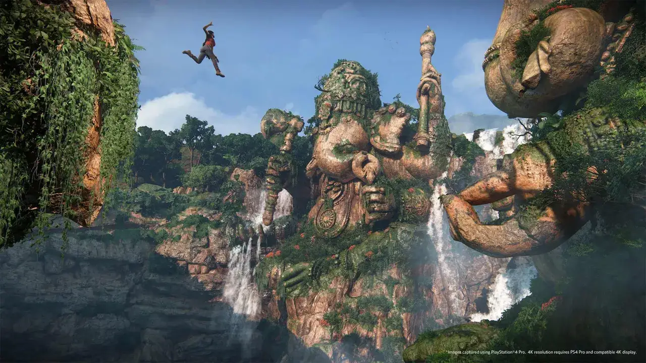 Aventura en Uncharted: El Legado Perdido. Nathan Drake salta entre ruinas antiguas y cascadas, explorando un mundo exuberante.
