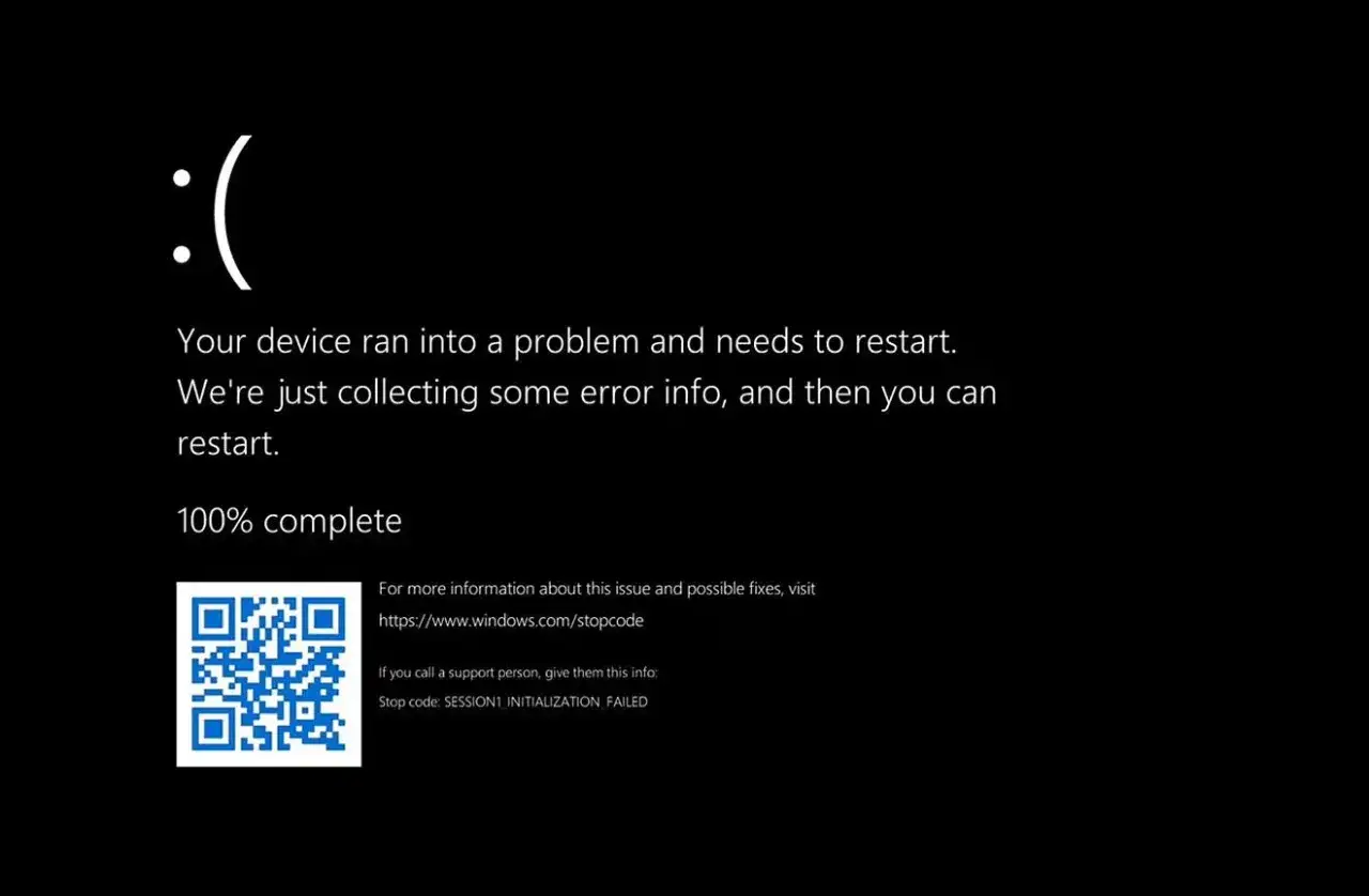 Smutna buźka na czarnym ekranie w laptopie. Błąd SESSION1_INITIALIZATION_FAILED.