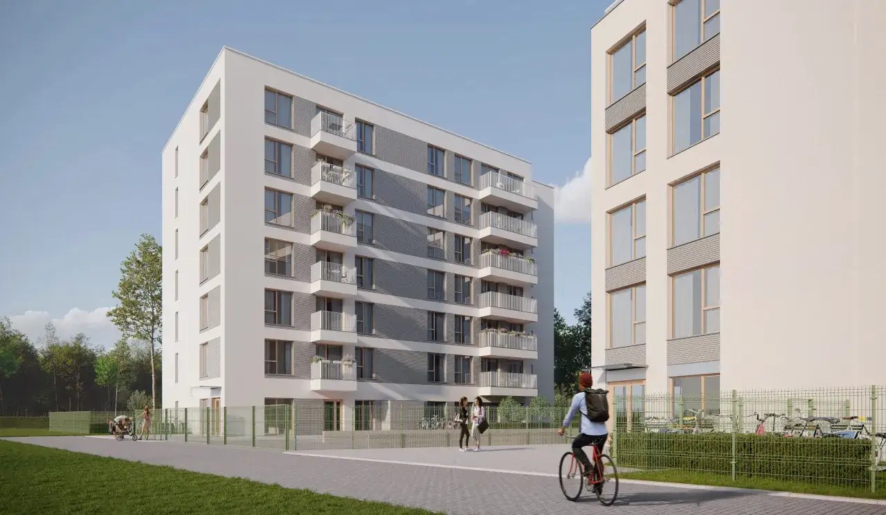 Nowoczesne budynki mieszkalne w Polsce, z balkonami i rowerami pod płotem. Vinci Immobilier Polska.
